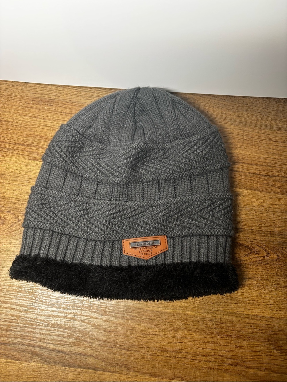 Match Gray Knit Hat with Black Faux Fur Trim